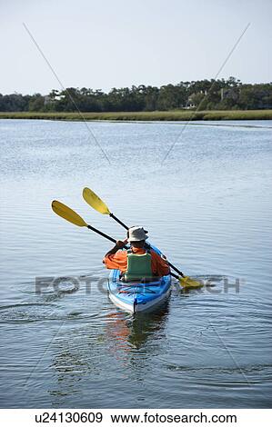 Back view of African American middle-aged couple paddling kayak. View Large Photo Image Stock Photo - Back view of African American middle-aged couple paddling kayak.. Fotosearch