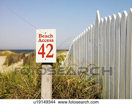 Beach access sign with picket fence at Bald Head Island, North Carolina. View Large Photo Image Picture - Beach access sign with picket fence at Bald Head Island, North Carolina.. Fotosearch