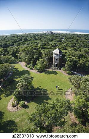 Stock Image - Birds eye view of tower building in wooded park at Bald Head Island, North Carolina.. Fotosearch