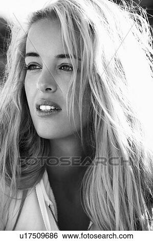 Stock Photograph - Black and white head and shoulder portrait of pretty blond Caucasian woman.. Fotosearch