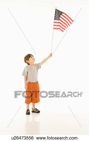Boy holding American flag against white background. View Large Photo Image Stock Photograph - Boy holding American flag against white background.. Fotosearch