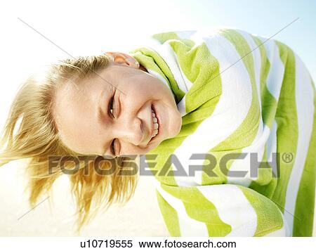 Caucasian girl with towel wrapped around her looking at viewer. View Large Photo Image Stock Photography - Caucasian girl with towel wrapped around her looking at viewer.. Fotosearch