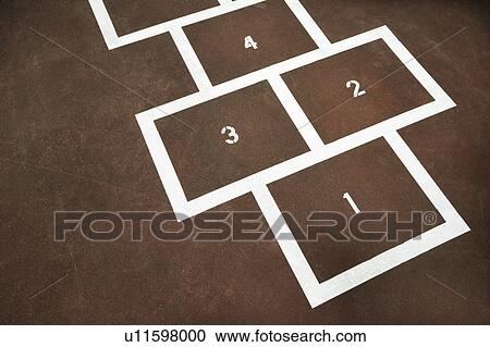 Stock Image - Children's hopscotch on playground concrete.. Fotosearch
