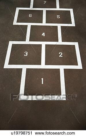 Stock Image - Children's hopscotch on playground concrete.. Fotosearch