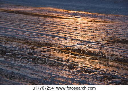 Close up of ice covered road with tire marks. View Large Photo Image Picture - Close up of ice covered road with tire marks.. Fotosearch