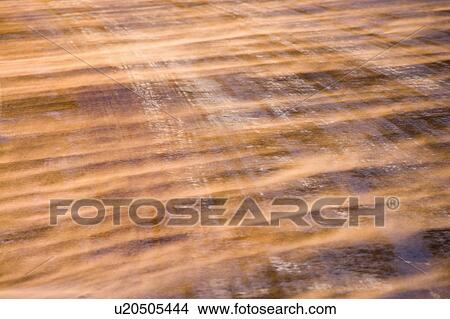Close up of ice covered road with tire marks. View Large Photo Image Picture - Close up of ice covered road with tire marks.. Fotosearch