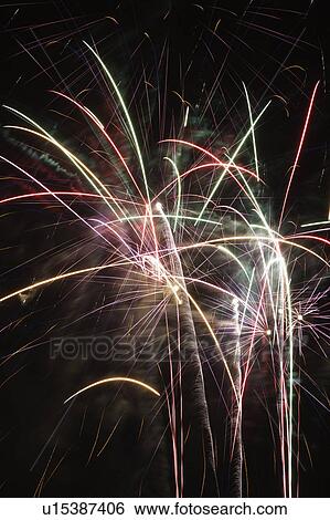 Colorful fireworks exploding in night sky. View Large Photo Image Stock Photograph - Colorful fireworks exploding in night sky.. Fotosearch