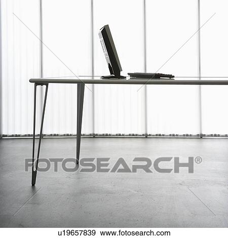 Stock Photo - Computer monitor and keyborad on modern table.. Fotosearch