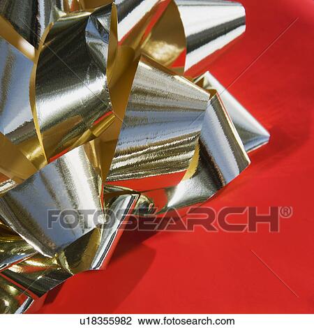 Detail of a gold bow. View Large Photo Image Stock Image - Detail of a gold bow.. Fotosearch