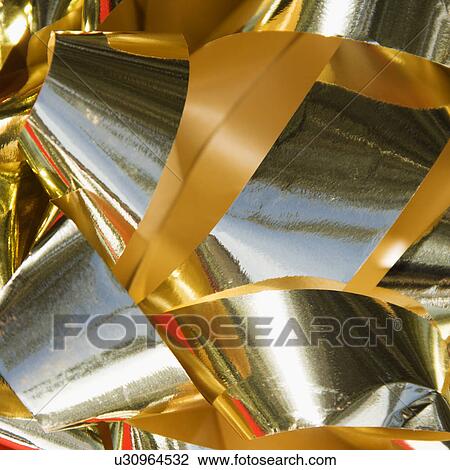 Stock Image - Detail of a gold bow.. Fotosearch