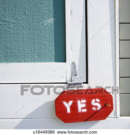 Detail of exterior wooden door on building with sign reading yes. View Large Photo Image Stock Photo - Detail of exterior wooden door on building with sign reading yes.. Fotosearch