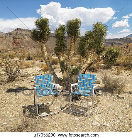 Empty plaid lawn chairs in desert landscape. View Large Photo Image Stock Image - Empty plaid lawn chairs in desert landscape.. Fotosearch