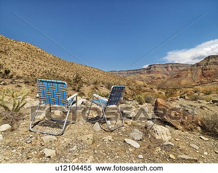 Empty plaid lawn chairs in desert landscape. View Large Photo Image Stock Photography - Empty plaid lawn chairs in desert landscape.. Fotosearch