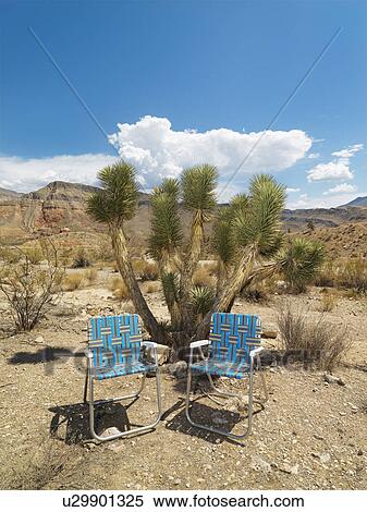 Empty plaid lawn chairs in desert landscape. View Large Photo Image Stock Photography - Empty plaid lawn chairs in desert landscape.. Fotosearch