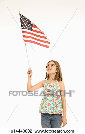 Girl holding American flag against white background. View Large Photo Image Stock Image - Girl holding American flag against white background.. Fotosearch