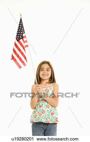 Girl holding American flag against white background. View Large Photo Image Stock Image - Girl holding American flag against white background.. Fotosearch