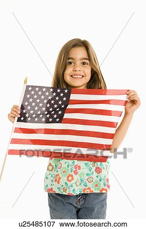 Girl holding American flag against white background. View Large Photo Image Stock Photo - Girl holding American flag against white background.. Fotosearch
