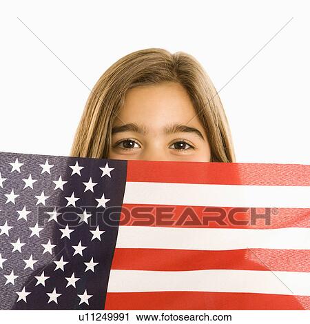 Girl peeking over American flag against white background. View Large Photo Image Stock Image - Girl peeking over American flag against white background.. Fotosearch