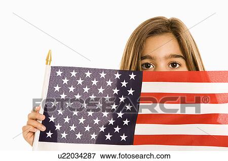 Girl peeking over American flag against white background. View Large Photo Image Stock Photo - Girl peeking over American flag against white background.. Fotosearch