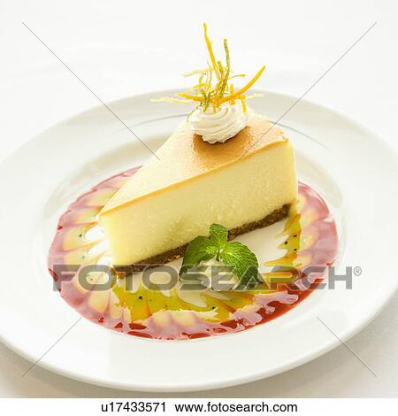 Gourmet slice of cheesecake garnished with zest and sauce and mint sprig. View Large Photo Image Stock Image - Gourmet slice of cheesecake garnished with zest and sauce and mint sprig.. Fotosearch