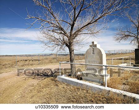 Stock Photo - Headstone at the corner of a cemetery.. Fotosearch