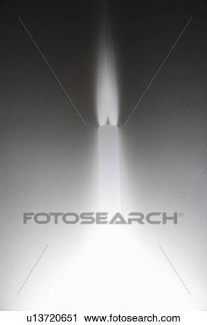 Stock Image - Interior of wall with sconce lighting.. Fotosearch