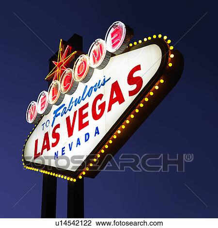 Stock Image - Lighted Las Vegas welcome sign with night sky.. Fotosearch