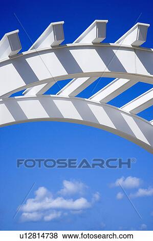Low angle view of arched white arbor with blue sky. View Large Photo Image Stock Photo - Low angle view of arched white arbor with blue sky.. Fotosearch