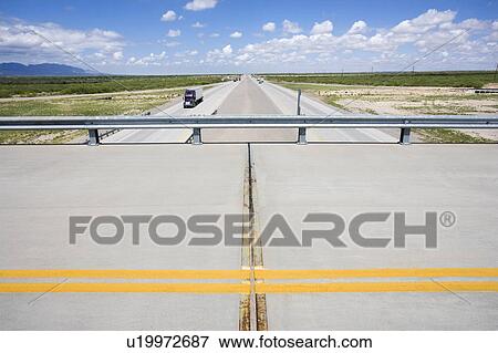 Overpass with highway below with tractor trailer truck. View Large Photo Image Stock Photo - Overpass with highway below with tractor trailer truck.. Fotosearch