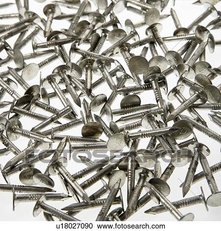Pile of nails against white background. View Large Photo Image Stock Image - Pile of nails against white background.. Fotosearch