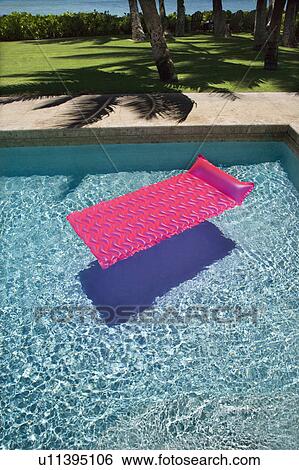 Pink float in empty swimming pool. View Large Photo Image Stock Photograph - Pink float in empty swimming pool.. Fotosearch