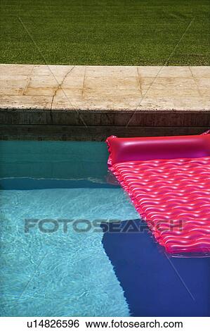 Pink float in empty swimming pool. View Large Photo Image Stock Photograph - Pink float in empty swimming pool.. Fotosearch