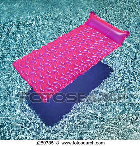 Pink float in empty swimming pool with rippling blue pool. View Large Photo Image Stock Photo - Pink float in empty swimming pool with rippling blue pool.. Fotosearch