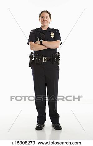 Portrait of mid adult Caucasian female law enforcement officer standing with arms crossed looking at viewer smiling. View Large Photo Image Stock Photo - Portrait of mid adult Caucasian female law enforcement officer standing with arms crossed looking at viewer smiling.. Fotosearch