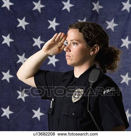 Portrait of mid adult Caucasian policewoman saluting with American flag as backdrop. View Large Photo Image Stock Photo - Portrait of mid adult Caucasian policewoman saluting with American flag as backdrop.. Fotosearch