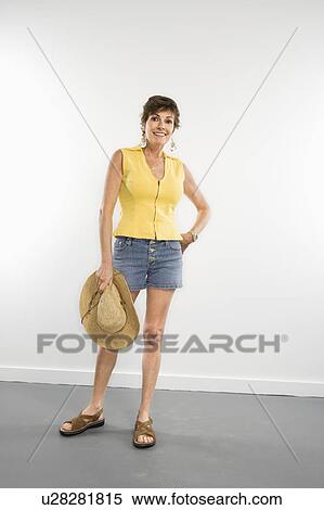 Stock Photography - Portrait of pretty Caucasian woman in summer attire smiling.. Fotosearch