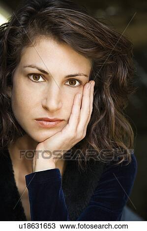 Portrait of pretty mid adult Caucasian woman with head on hand making eye contact. View Large Photo Image Stock Image - Portrait of pretty mid adult Caucasian woman with head on hand making eye contact.. Fotosearch