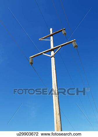 Stock Image - Power line against blue sky.. Fotosearch