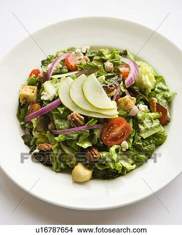 Prepared salad with walnuts and tomatoes. View Large Photo Image Picture - Prepared salad with walnuts and tomatoes.. Fotosearch