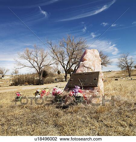 Quartz tombstone with flowers around it in cemetary. View Large Photo Image Stock Image - Quartz tombstone with flowers around it in cemetary.. Fotosearch