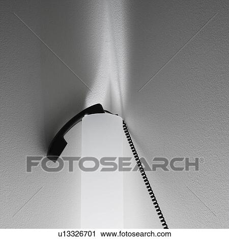 Receiver of corded telephone resting on sconce lighting on wall. View Large Photo Image Stock Image - Receiver of corded telephone resting on sconce lighting on wall.. Fotosearch
