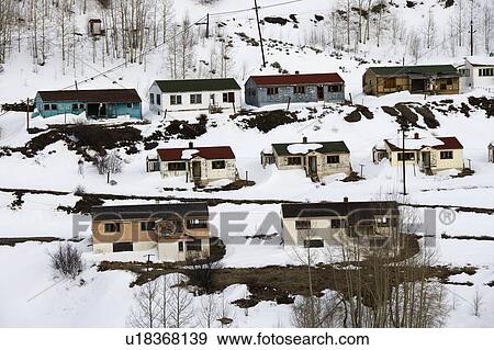Stock Photo - Rural abandoned houses on snowy mountainside.. Fotosearch