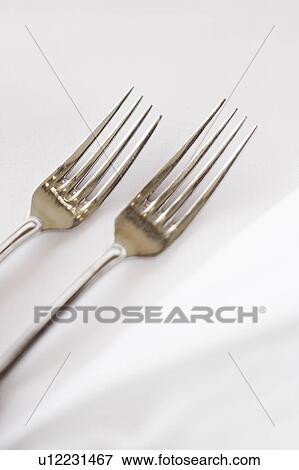 Sald fork and dinner fork on white table cloth. View Large Photo Image Stock Photo - Sald fork and dinner fork on white table cloth.. Fotosearch