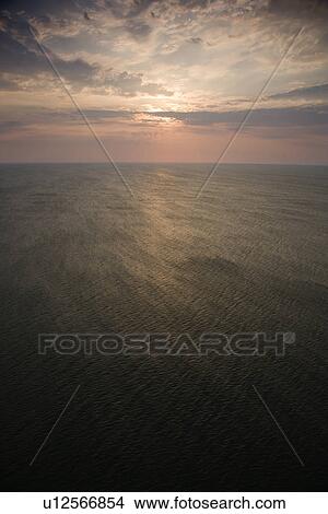 Scenic Bald Head Island North Carolina landscape of sunrise over ocean. View Large Photo Image Picture - Scenic Bald Head Island North Carolina landscape of sunrise over ocean.. Fotosearch