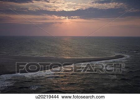 Scenic Bald Head Island North Carolina landscape of shoreline during sunrise. View Large Photo Image Picture - Scenic Bald Head Island North Carolina landscape of shoreline during sunrise.. Fotosearch