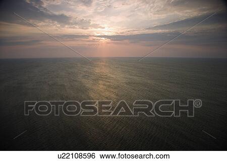 Scenic Bald Head Island North Carolina landscape of sunrise over ocean. View Large Photo Image Stock Photograph - Scenic Bald Head Island North Carolina landscape of sunrise over ocean.. Fotosearch