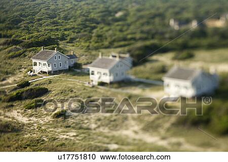 Stock Image - Selective focus aerial of beach cottages in Bald Head Island, North Carolina.. Fotosearch