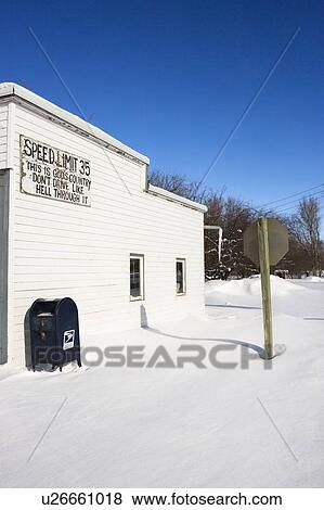Stock Photo - Small town street scene with building and postal mailbox.. Fotosearch