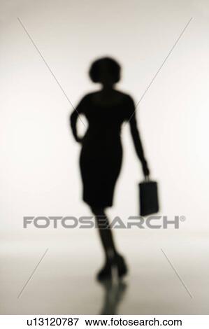 Soft focus silhouette of businesswoman holding briefcase. View Large Photo Image Stock Photo - Soft focus silhouette of businesswoman holding briefcase.. Fotosearch