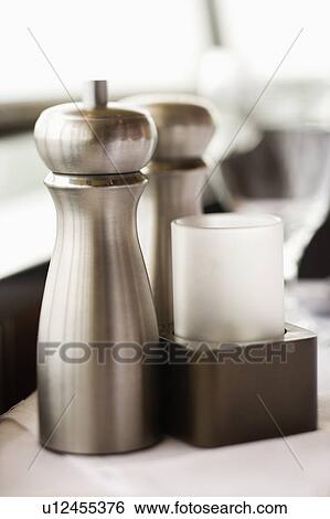 Stock Photograph - Stainless steel salt and pepper shaker.. Fotosearch